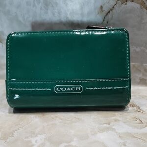 Coach Medium Corner Zip Wallet in an emerald green patent or Spazzolato leather.